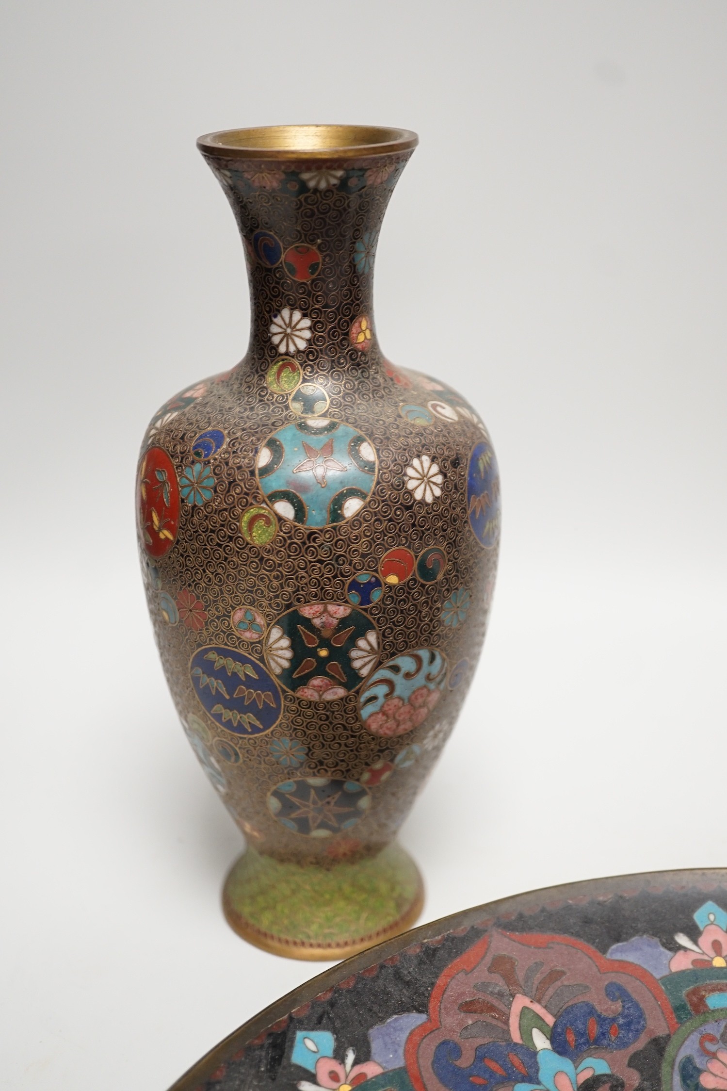 A Japanese cloisonné enamel dish, 30.5cm diameter and a pair of Japanese cloisonné enamel vases. (3)